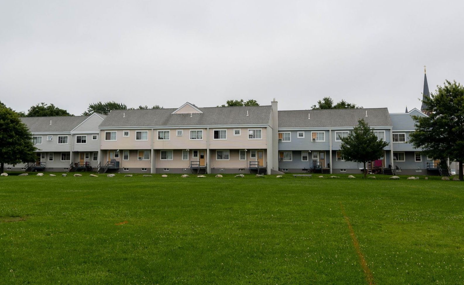 A wide angle picture of the Kennedy Park apartments along the Fox Street Soccer field